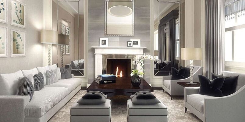 A living room with two couches and a fireplace.